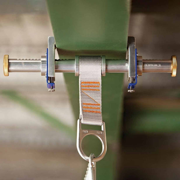 Ferno ratchet type fixed beam anchor clamped to an I beam flange for fall arrest